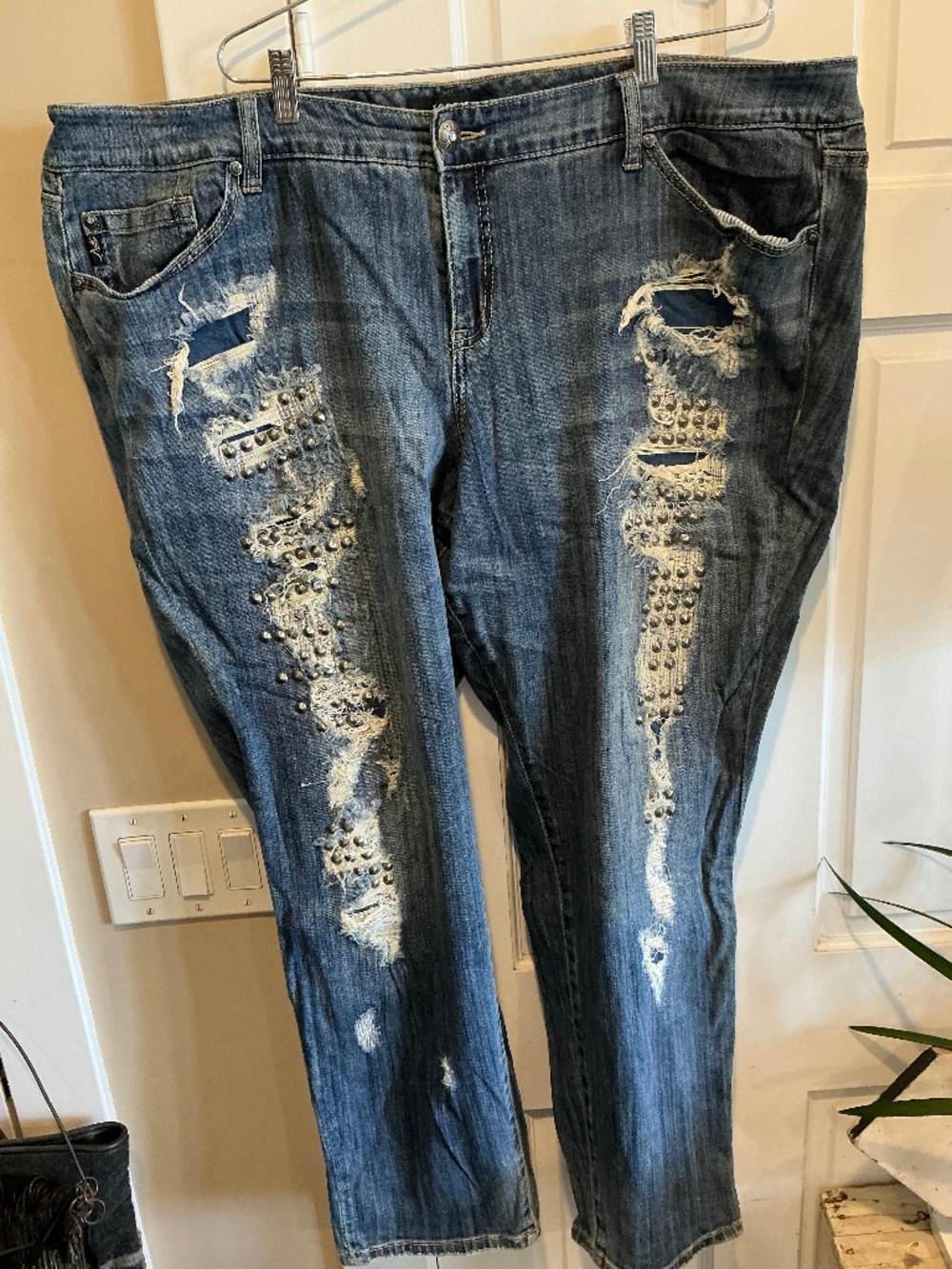 Very cool torrid jeans with distressing and studs! Plus size 24